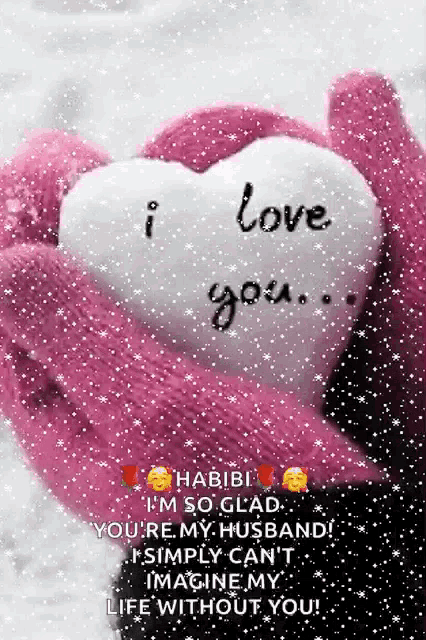 a pink mitten is holding a white heart that says " i love you "