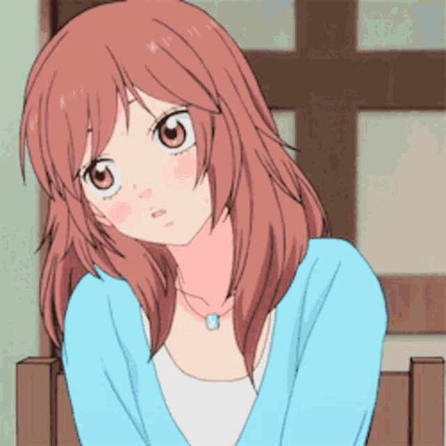 a girl with long brown hair is wearing a blue sweater