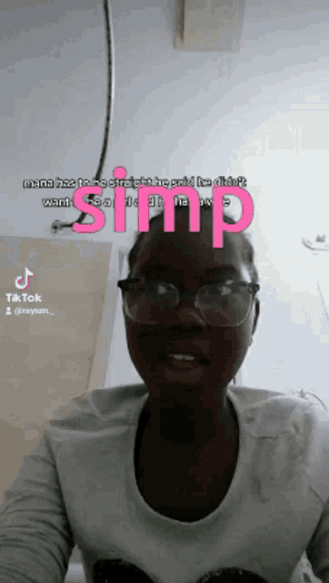a woman wearing glasses and a shirt that says ' stiff ' on it
