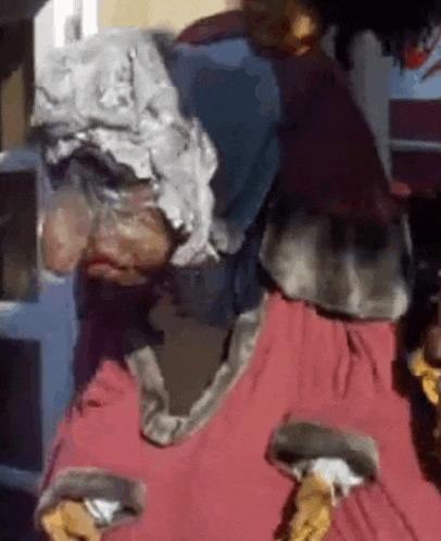 a close up of a person wearing a costume with a hood on their head .