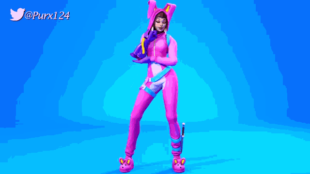 a girl in a pink bunny costume is dancing