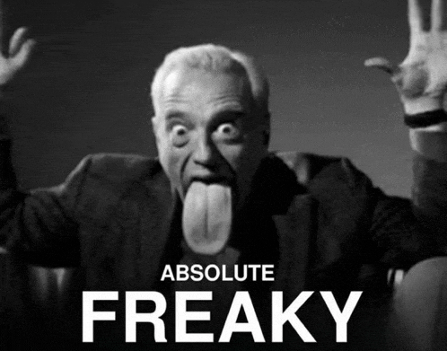 a black and white photo of a man sticking out his tongue with the words absolute freaky below him