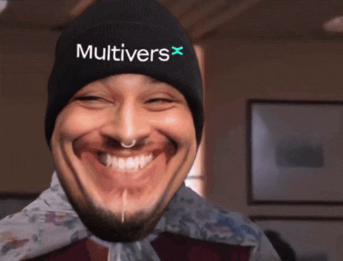 a man wearing a beanie that says multivers x on it