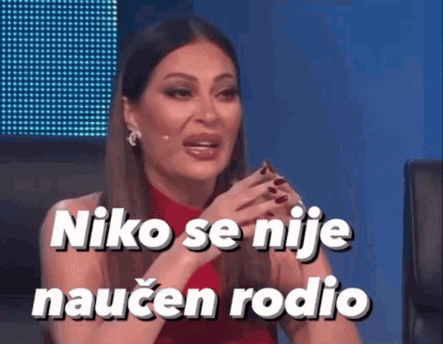 a woman in a red dress is crying with the words niko se nije naucen rodio written above her