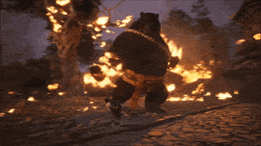a large object is surrounded by flames in a video game