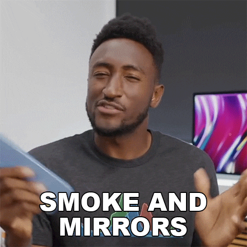 a man says smoke and mirrors while looking at his phone