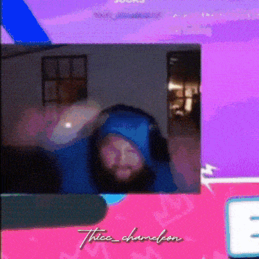 a picture of a man in a blue hoodie with the name thick chameleon written on the bottom