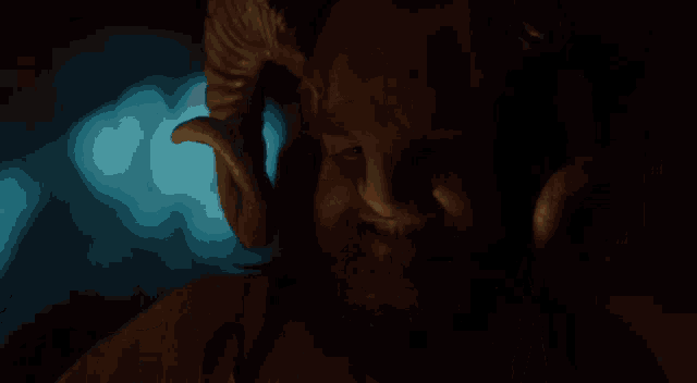 a man with a ram 's horn on his head
