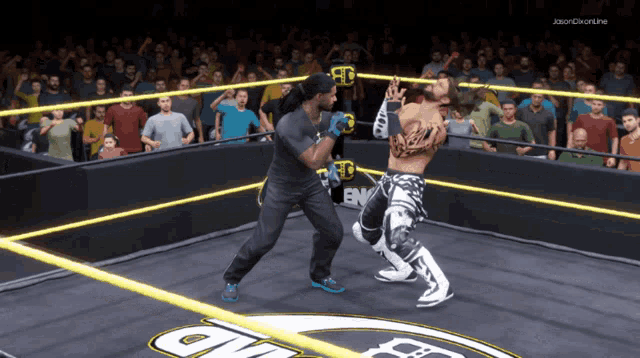 two wrestlers are fighting in a ring with a crowd behind them and the words jason on the bottom right