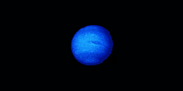 a blue circle with a face on it is lit up in a dark room