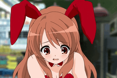 a girl with red bunny ears and a red bow on her neck