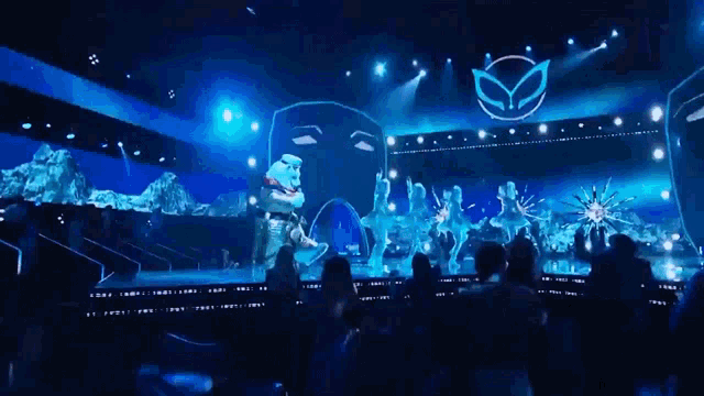 a group of people watching a performance on stage