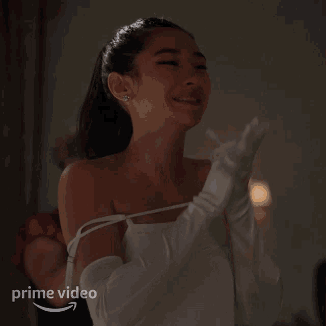 a woman in a white dress and white gloves is a prime video advertisement
