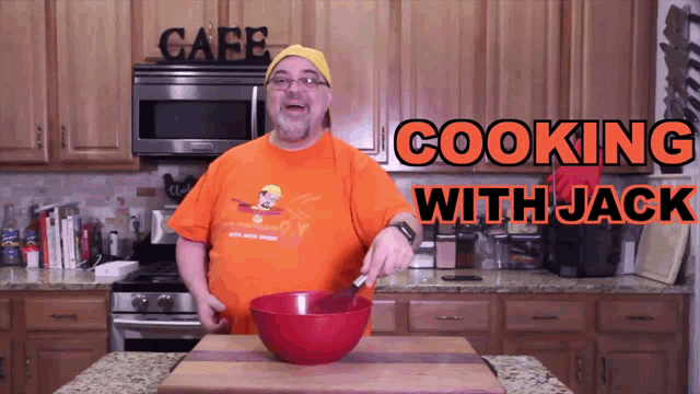 a man in an orange shirt is cooking with jack in a kitchen