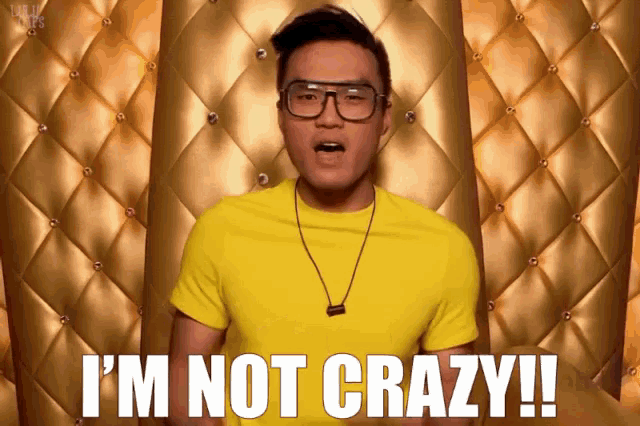 a man in a yellow shirt and glasses says i 'm not crazy