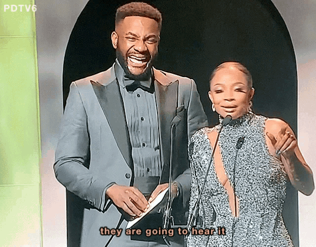 a man and a woman standing next to each other with the words they are going to hear it below them