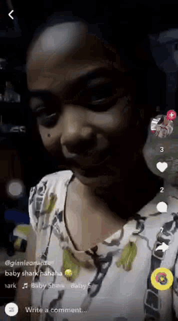 a girl is making a funny face in a video on a cell phone