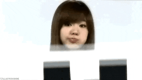 a close up of a woman 's face behind a block of paper .