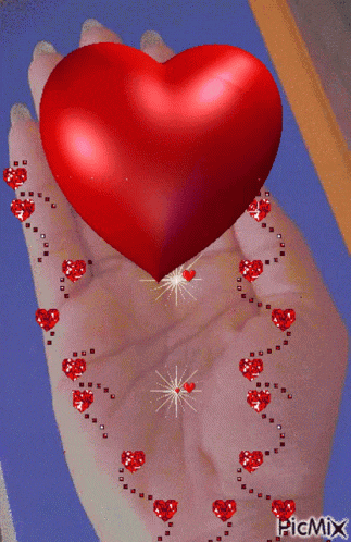 a picture of a hand holding a red heart with picmix written in the corner