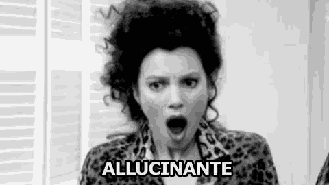 a black and white photo of a woman with a surprised look on her face and the words allucinante .