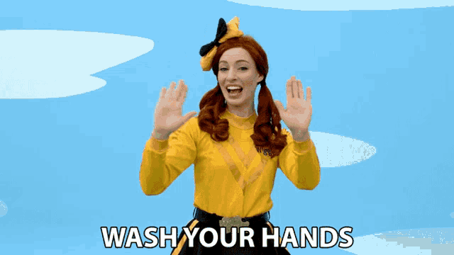 a woman in a yellow shirt with the words wash your hands below her