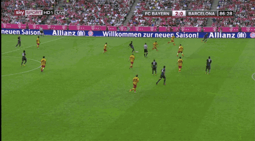 a soccer game between fc bayern and barcelona is being played