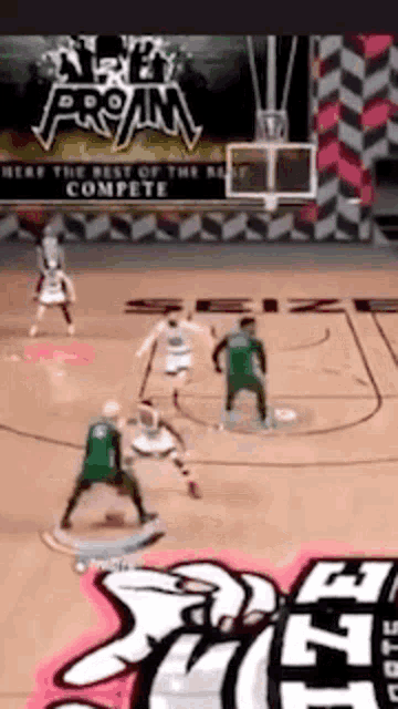 a basketball game is being played on a court with a sign above it that says " here the best of the best compete "