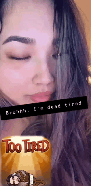 a woman with her eyes closed has a sticker on her face that says bruhhh i 'm dead tired