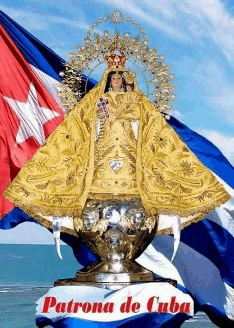 a picture of patrona de cuba with a statue in front of a flag