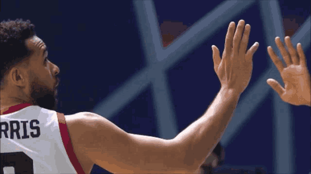 a basketball player wearing a jersey that says oris on it