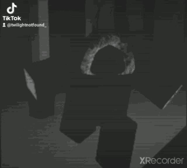 a white oval on a black background with a green border is a tiktok video .