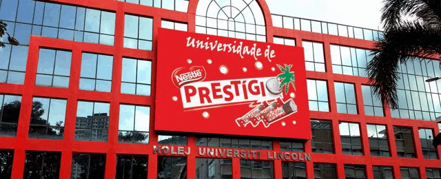 a red building with a nestle prestige sign on it
