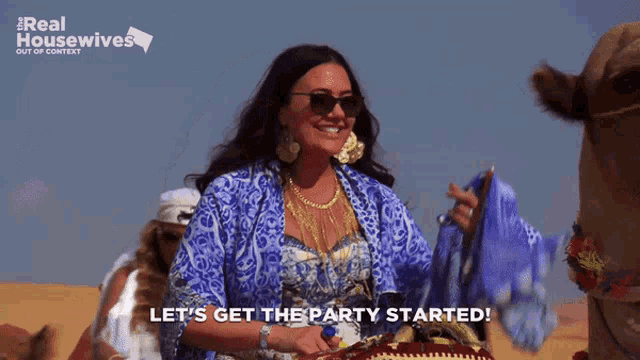 a woman riding a camel with the words let 's get the party started behind her