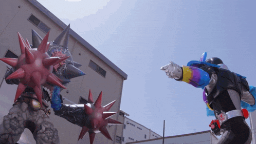 a cartoon character with spikes on his arms is fighting another cartoon character
