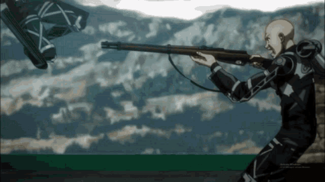 a man is holding a gun in front of mountains