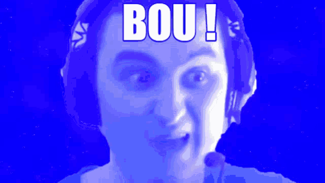 a man wearing headphones and a microphone has the word bou on his head