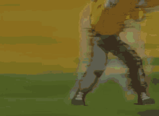 a man in a kbg shirt is being punched
