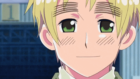 a close up of a boy with green eyes