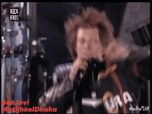 a man singing into a microphone with rock heroes written on the bottom