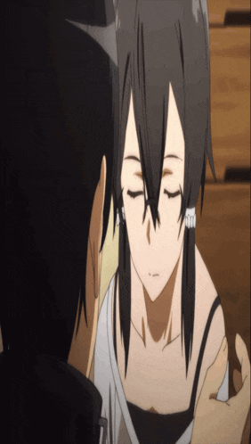 a man and a woman with their eyes closed