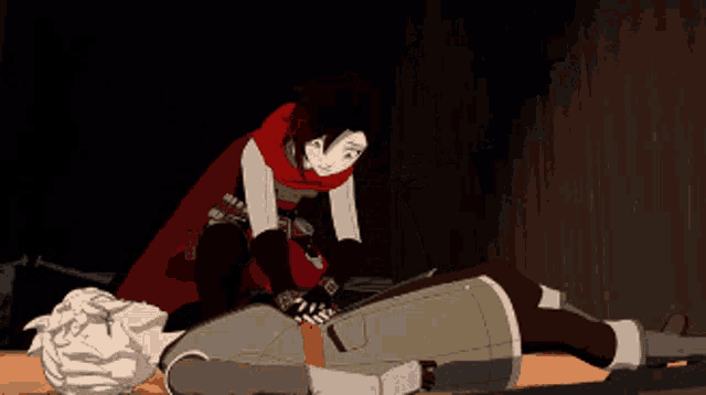 a girl in a red cape is laying on a man 's chest