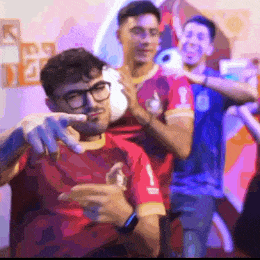 a man in a red shirt with the number 1 on the front