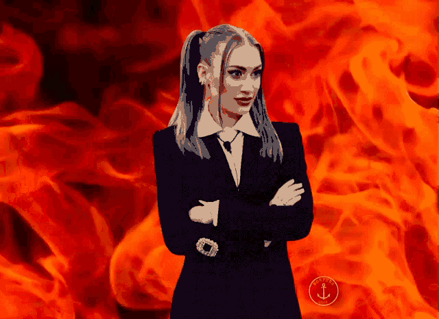 a woman in a suit and tie is standing in front of a fire background