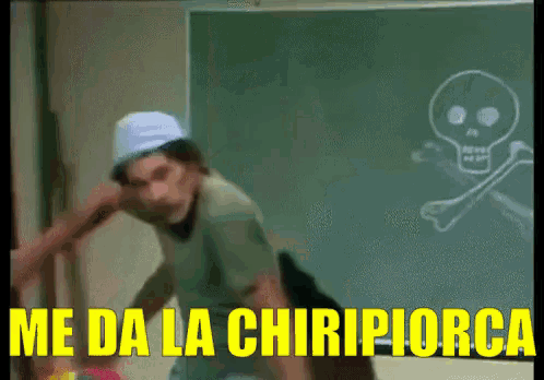 a cartoon character is standing in front of a blackboard with a skull drawn on it and the words me da la chiripiorca