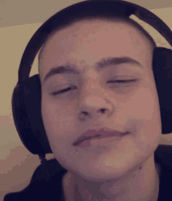 a close up of a person wearing headphones