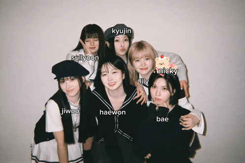 a group of girls posing for a picture with the names jiwoo haewon and nicky