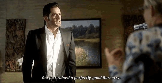 a man in a suit says " you just ruined a perfectly good burberry " in front of a painting