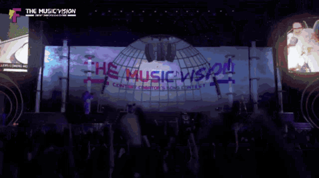 a large screen displays the music vision contest logo