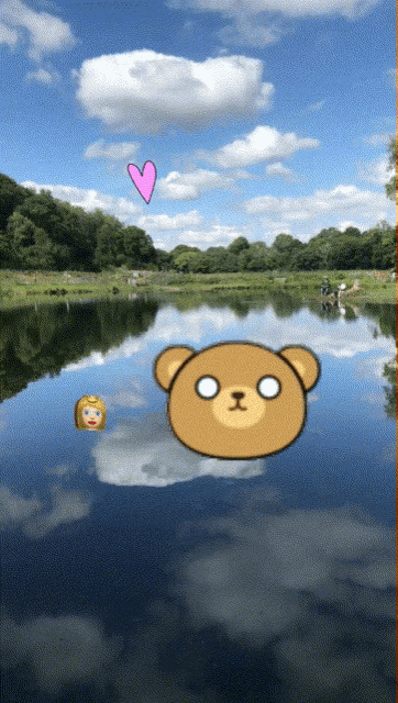 a picture of a lake with a teddy bear floating in the water