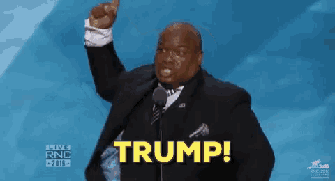 a man in a suit and tie says trump
